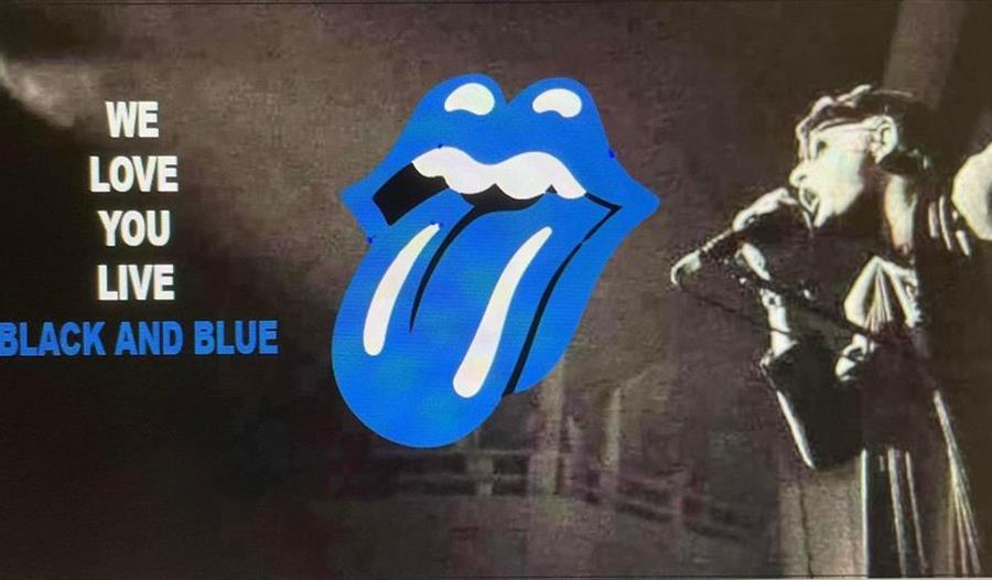 Singer on the stage and blue and white tongue