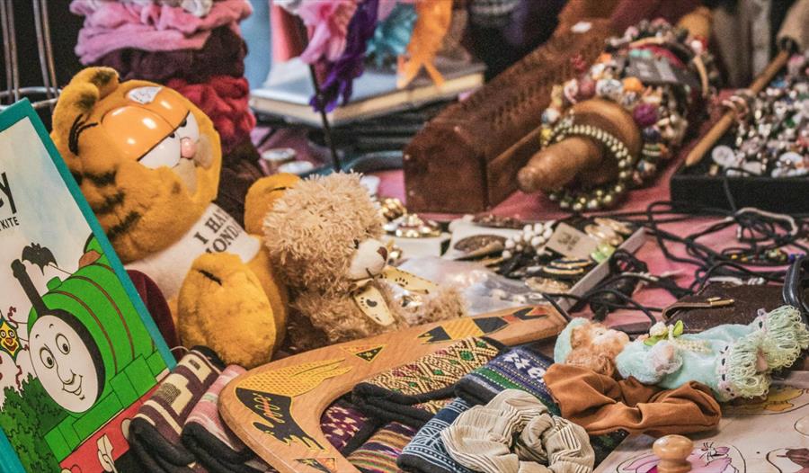 Toys, Books and Jewelry on a Market Stall