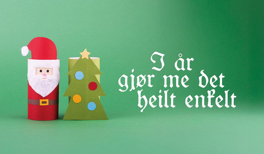 Julenissen og juletrepynt på grønn bakgrunn
