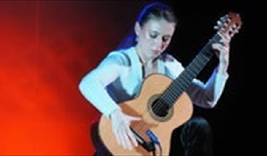 Woman playing guitar