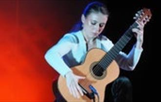 Woman playing guitar