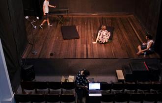 Man Standing on Stage