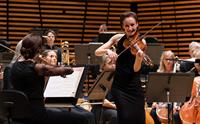 The Stavanger Symphony Orchestra with a standing solo violinist.